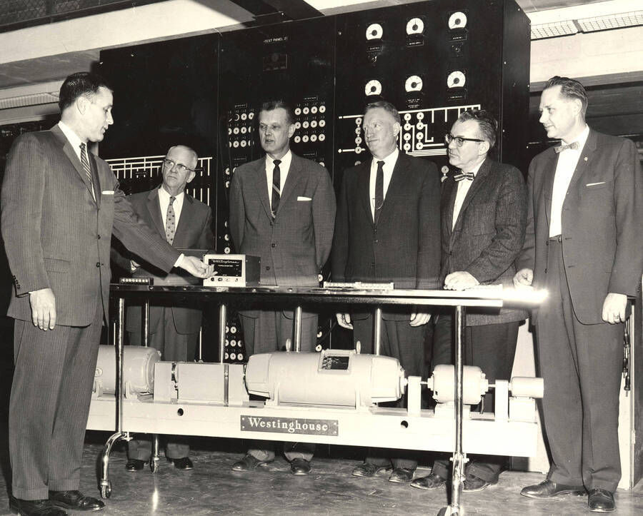 1960 photograph of Gifts. l-r: Charles H. Ebert, Jr., Walter H. Steffans, Allen S. Janssen, Paul Mann, and Harold Martindale. Donor: Publications Dept. [PG1_400-24]