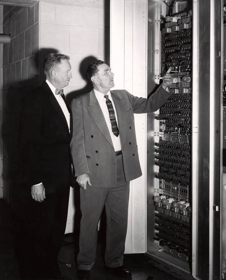 1958 photograph of Gifts. l-r: Prof. H. E. Hattrup, Electrical Engineering; W.S. Taylor, General Telephone supervisor. Donor: Publications Dept. [PG1_400-26]