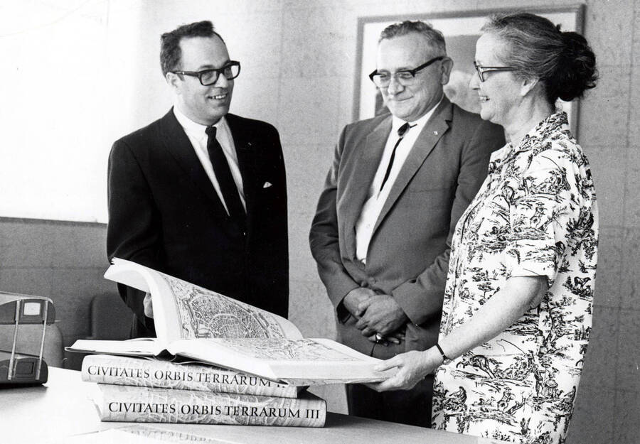 1967 photograph of Gifts. l-r: Richard Beck, Charles Webbert, and Nancy Atkinson. Donor: Publications Dept. [PG1_400-27]