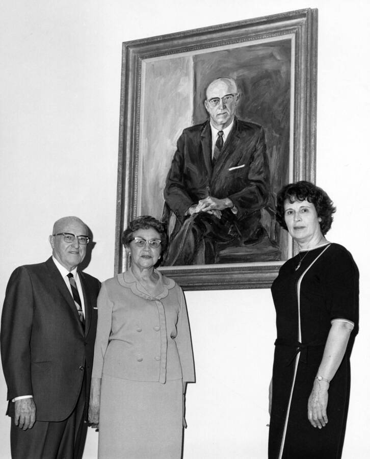 1966 photograph of Gifts. l-r; Mr. & Mrs. Theophilus, artist Mary Kirkwood. Donor: Publications Dept. [PG1_400-35]