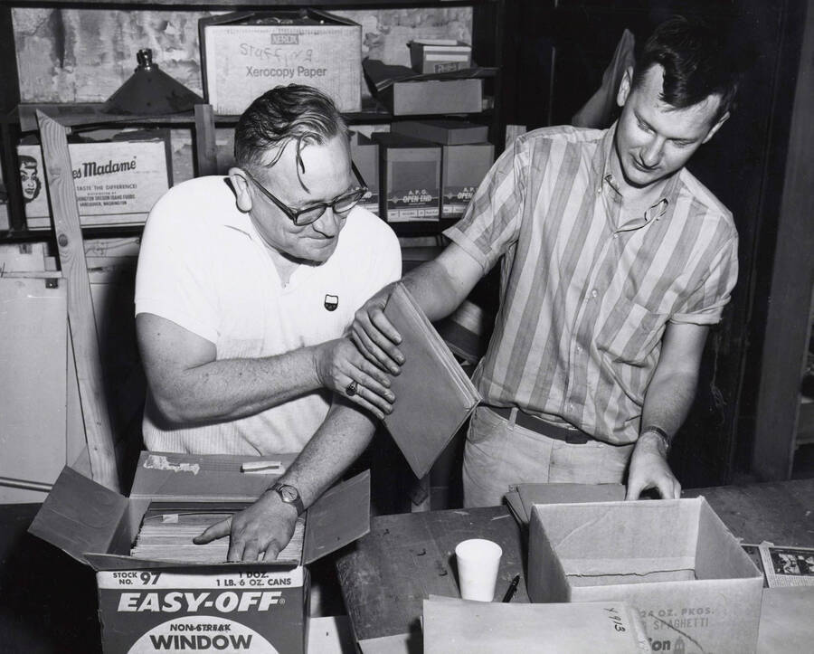 1965 photograph of Gifts. Charles Webbert and Paul Conditt processing the Barnard-Stockbridge photo negatives. [PG1_400-08]