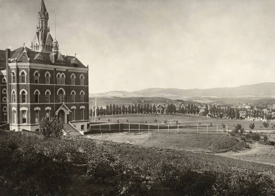 1902 photograph of Administration Building. View of the old administration and lawn with Moscow in the background. [PG1_51-18]