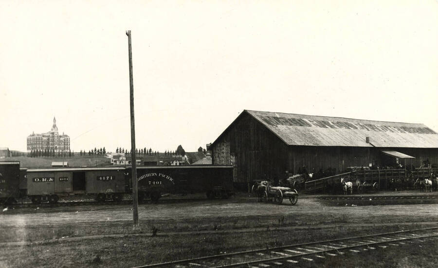 Administration Building, University of Idaho (1892-1906) from grain warehouse on railroad. [51-9]