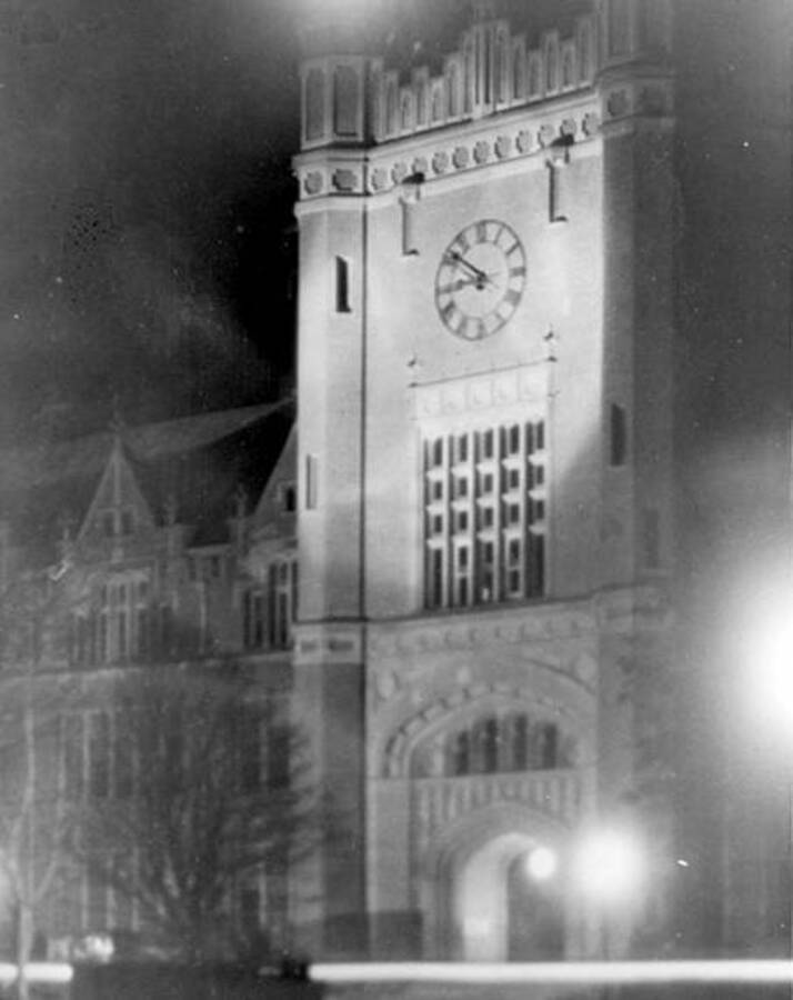 1925 photograph of Administration Building. View of the clock tower at night. [PG1_52-112]