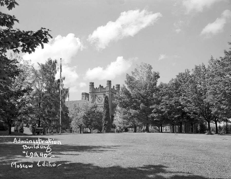 1948 photograph of Administration Building. View of the lawn, with cannon on the left. [PG1_52-139]
