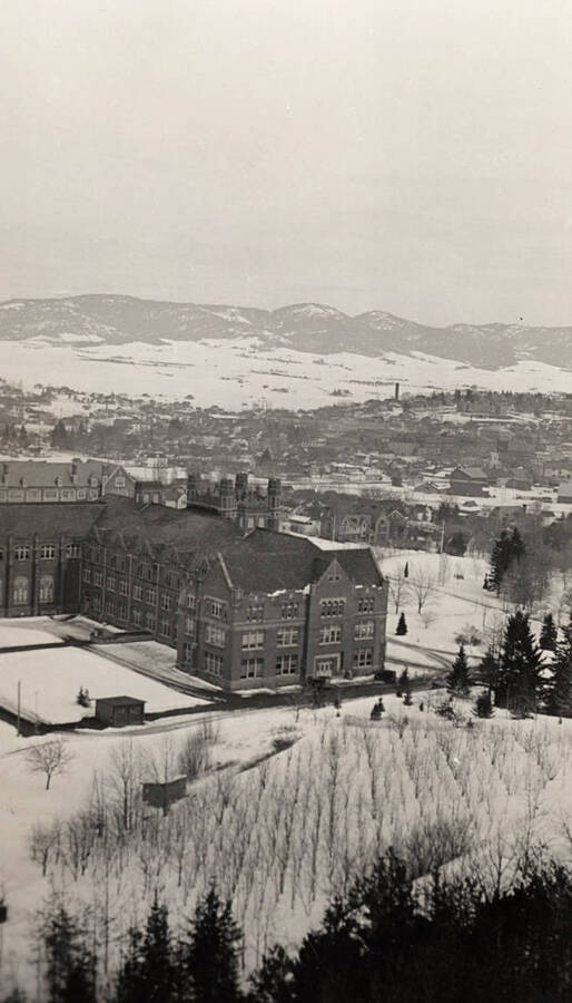 Administration Building, University of Idaho winter scene from hilltop. [52-149]