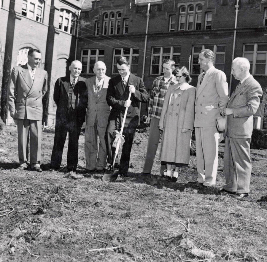1950-03-31 photograph of Administration Building Office Building (Annex) l-r: Harry Dewey, Fred Skog, Jay G. Eldridge, J.L. McCarthy, Robert Moulton, Janice McCormick, J.E. Buchanan, T.S. Kerr. [PG1_53-02a]