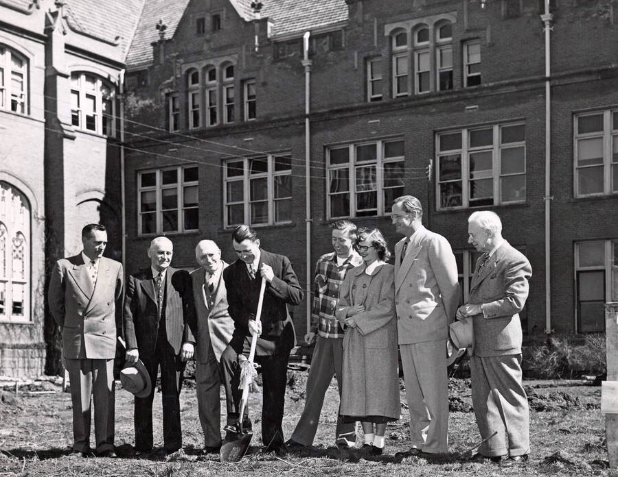1950-03-29 photograph of Administration Building Office Building (Annex) l-r: Harry Dewey, Fred Skog, Jay G. Eldridge, J.L. McCarthy, Robert Moulton, Janice McCormick, J.E. Buchanan, T.S. Kerr. [PG1_53-01]