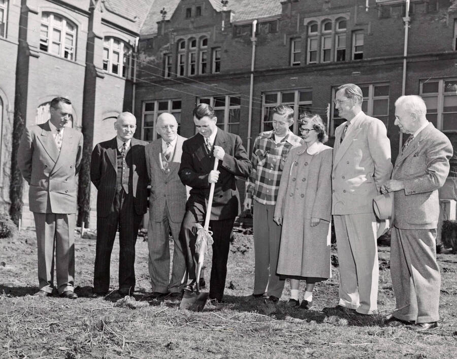 1950-03-30 photograph of Administration Building Office Building (Annex) l-r: Harry Dewey, Fred Skog, Jay G. Eldridge, J.L. McCarthy, Robert Moulton, Janice McCormick, J.E. Buchanan, T.S. Kerr. [PG1_53-02]