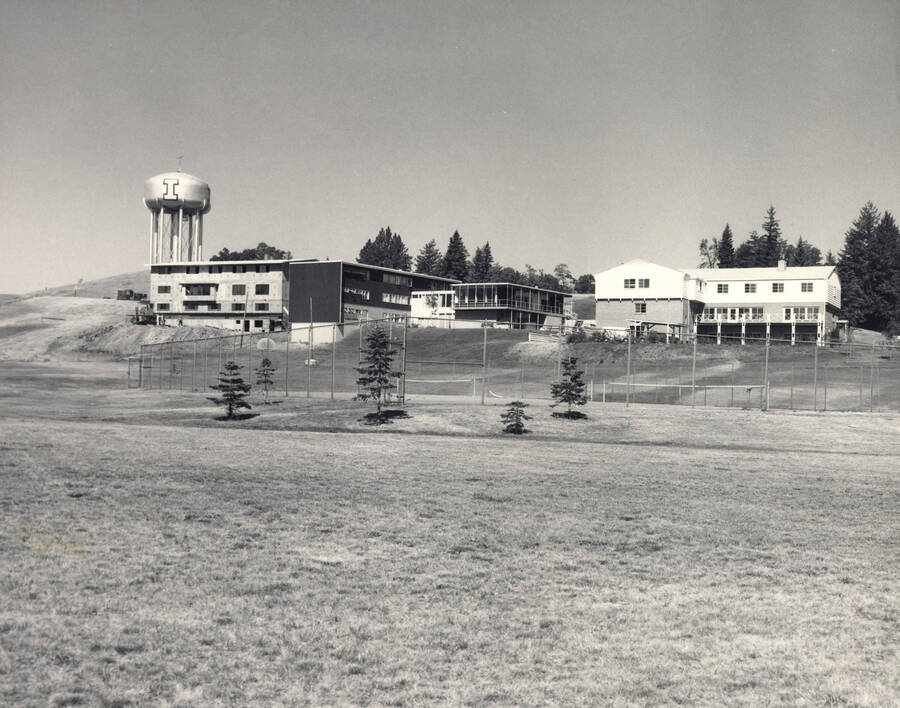 1960 photograph of University of Idaho campus scenery. View of the back of New Greek Row and the new water tower. [PG1_006-52]