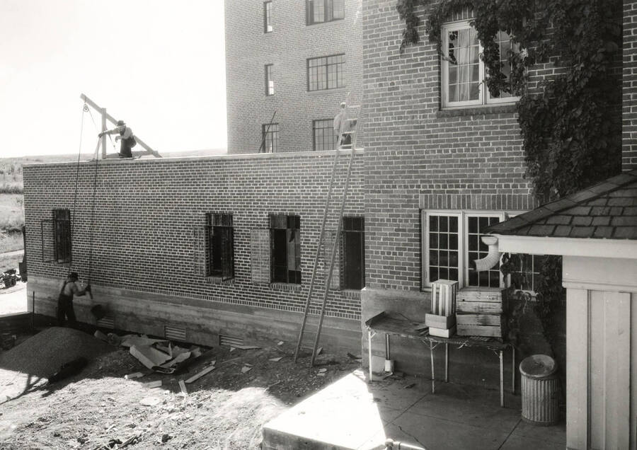 1936 photograph of Forney Hall. View from the back of Hays and Forney kitchen construction. [PG1_60-17]