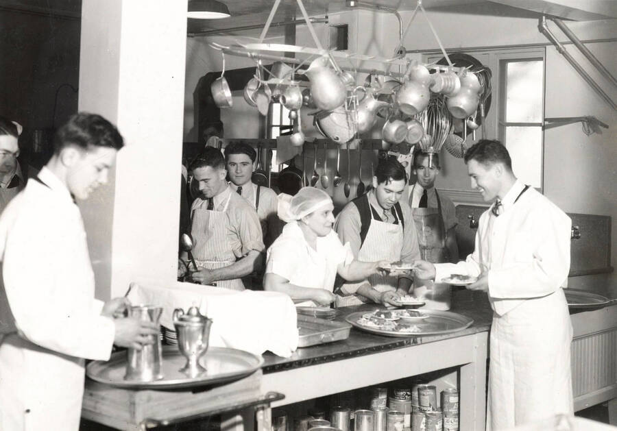 1936 photograph of Forney Hall. View of kitchen and staff. [PG1_60-18]