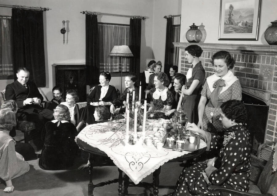 1930 photograph of Forney Hall. Members gathered for a tea.[PG1_60-19]