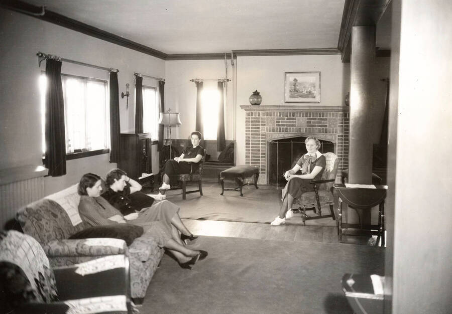 1935 photograph of Forney Hall. Residents shown sitting in the lounge. [PG1_60-27]
