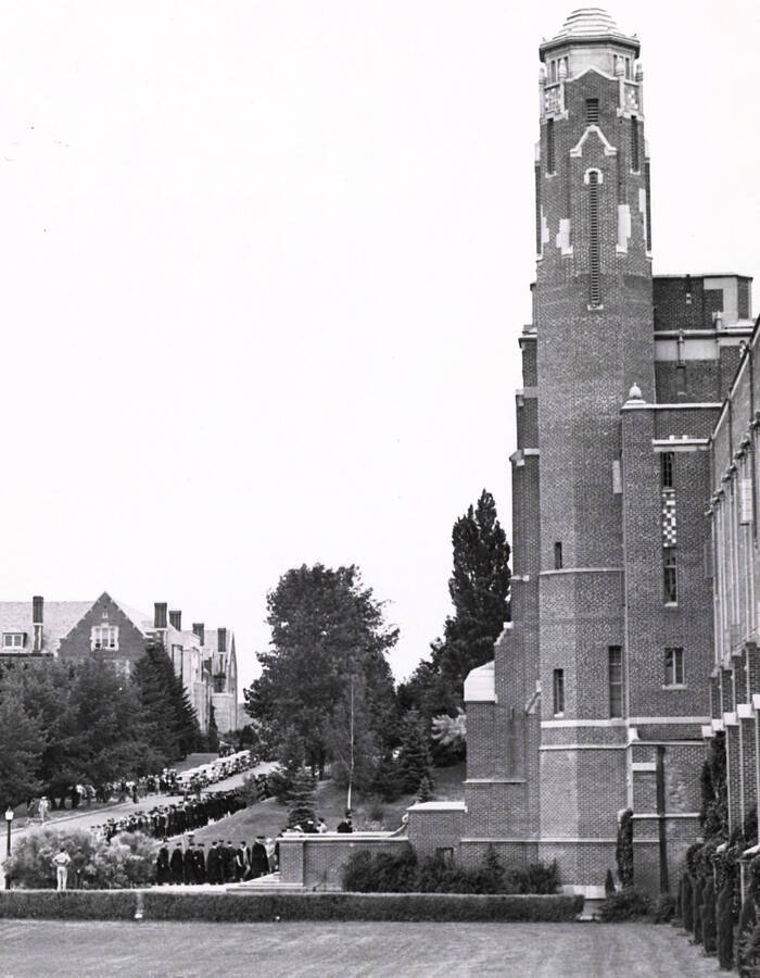 1940-06-16 photograph of Memorial Gymnasium. Graduates walk for commencements. [PG1_61-13]