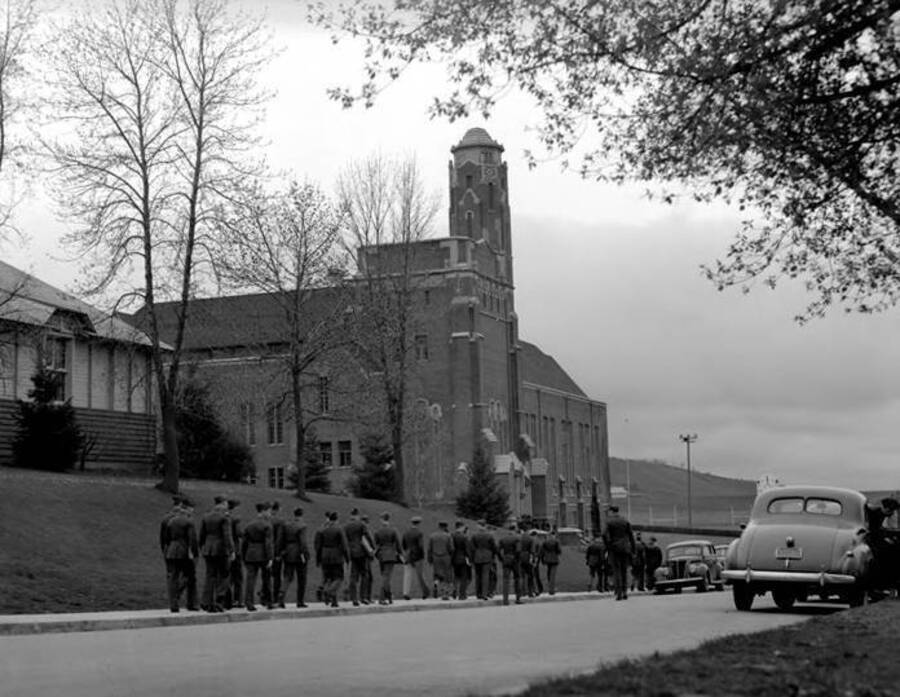 1932 photograph of Memorial Gymnasium. View of Cadets on walkway. [PG1_61-36a]
