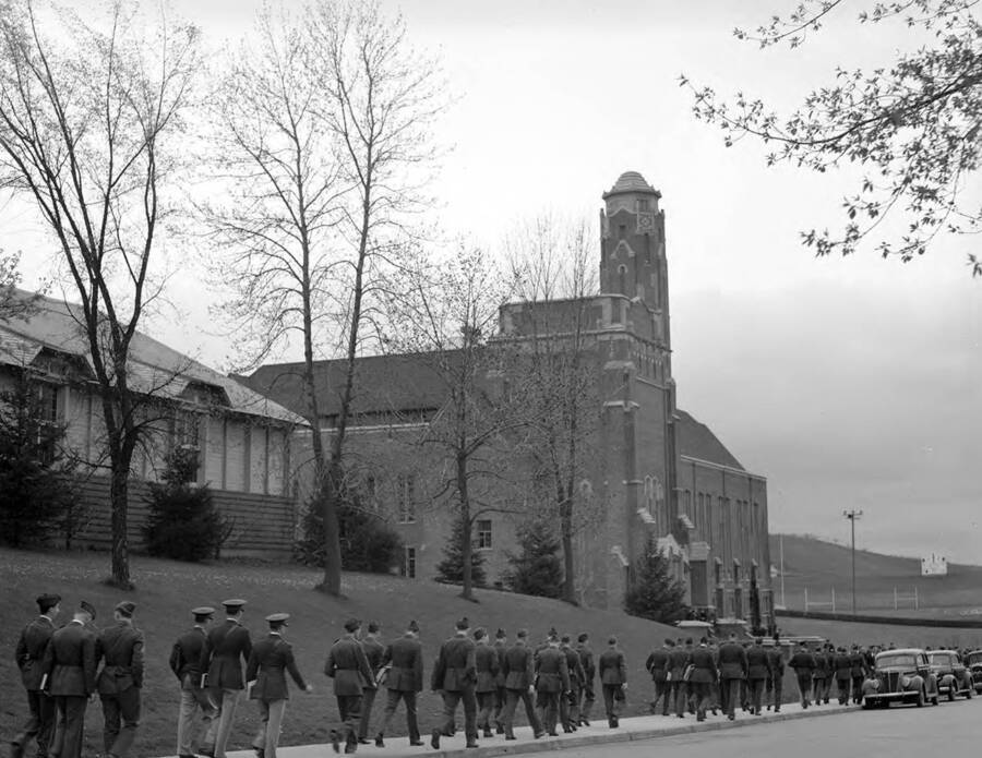 1925 photograph of Memorial Gymnasium. View of Cadets on walkway. [PG1_61-36b]