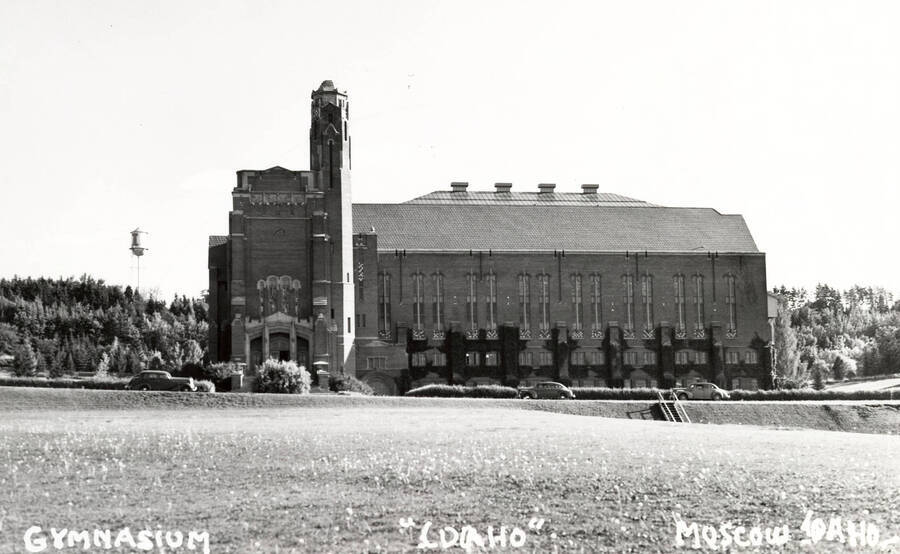 1950 photograph of Memorial Gymnasium. View from across the street old water tower on left. [PG1_61-47]