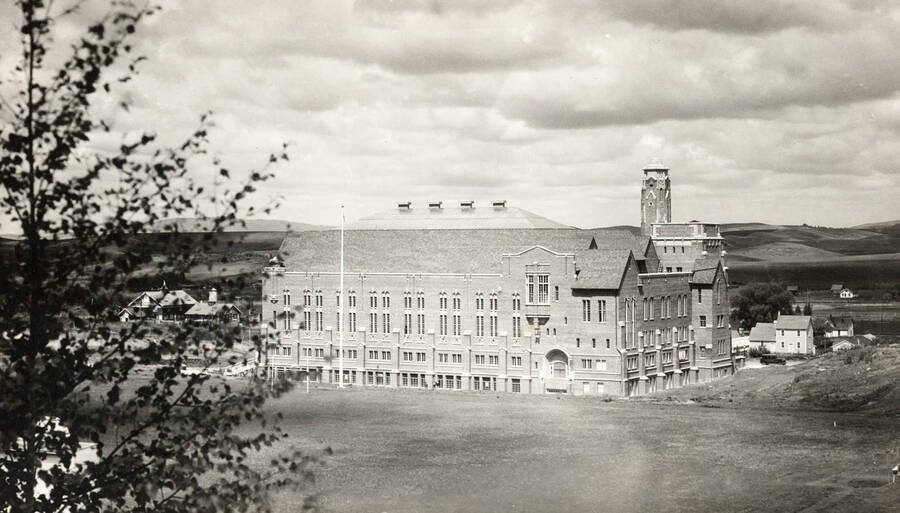 1930 photograph of Memorial Gymnasium. View from the top of the hill with fields in the background. Donor: Virginia R. Vanderhoff. [PG1_61-50]
