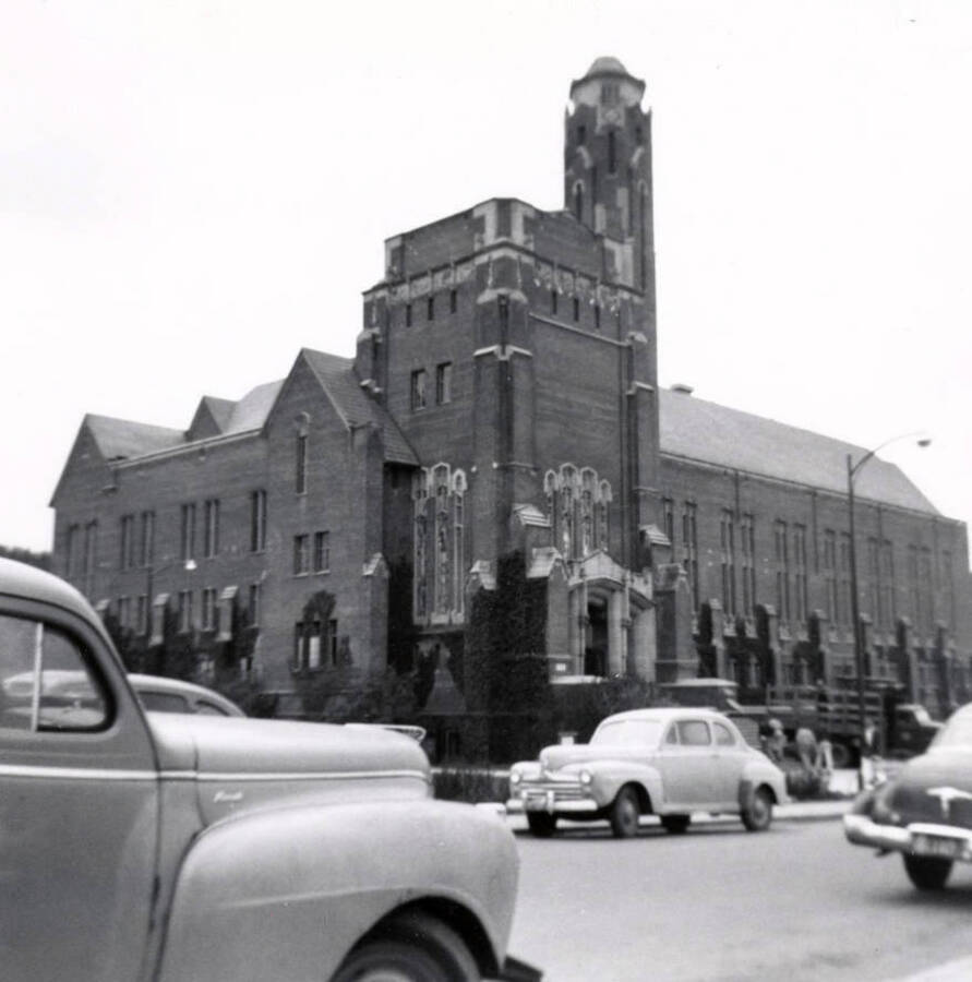 1952-05-01 photograph of Memorial Gymnasium. View of automobiles and northeast corner. Donor: Gary Cox. [PG1_61-52]