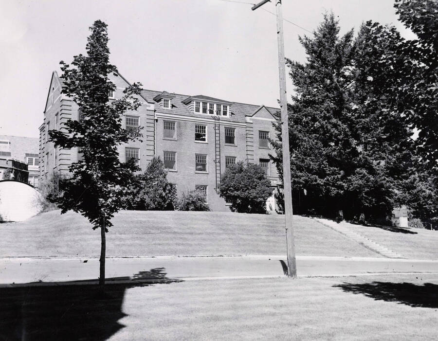 1936 photograph of Lindley Hall. View from across the lawn seen through the trees. [PG1_62-13]