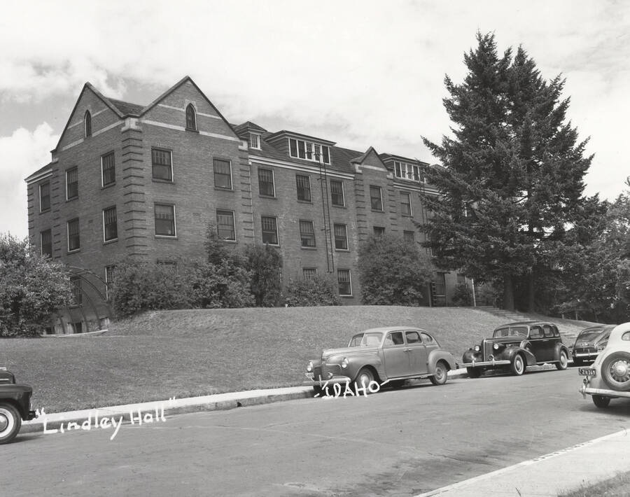 1947 photograph of Lindley Hall. Street with automobiles out front. [PG1_62-17]
