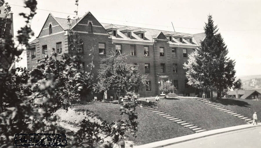 1926 photograph of Lindley Hall. Residents shown sitting on the lawn. [PG1_62-09]