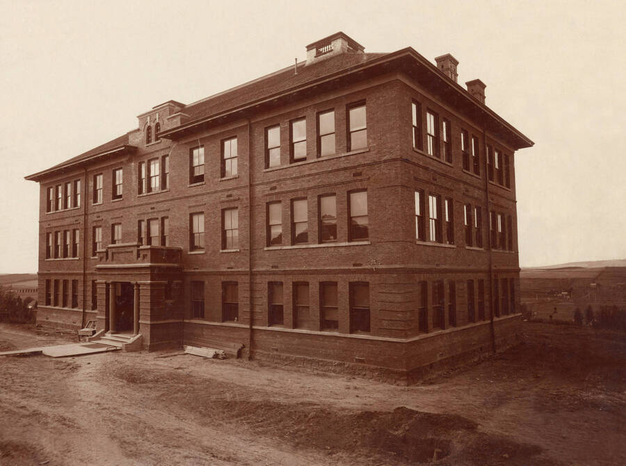 1906 photograph of Morrill Hall with construction debris out front. [PG1_66-02]
