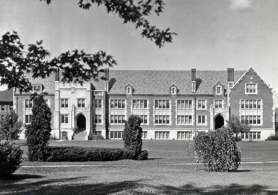 1936 photograph of Science Hall Renamed Life Sciences Building. View of student at entrance. [PG1_067-32]