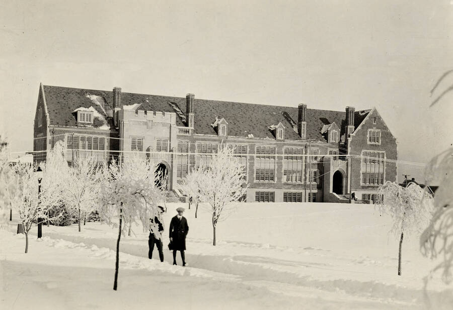 1932 photograph of Science Hall Renamed Life Sciences Building in 1964. View of students walking to class in the snow. Donor: Donald DuSault. [PG1_067-46]