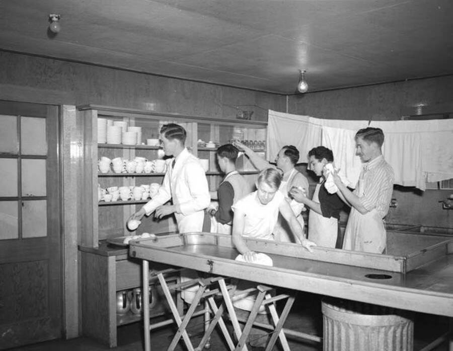 1943 photograph of Campus Club. View residents working in kitchen. [PG1_072-13]