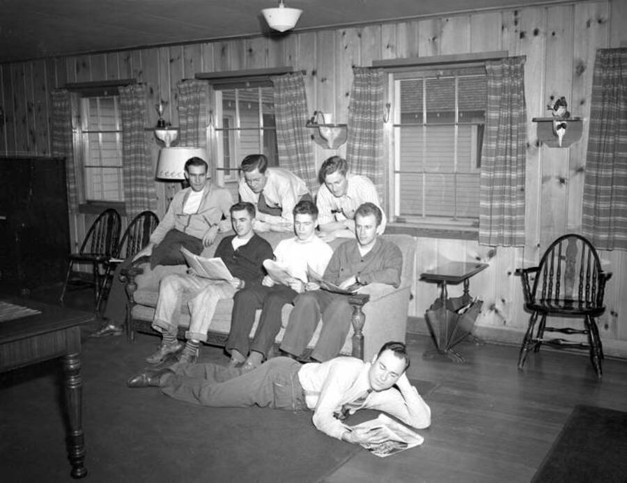 1943 photograph of Campus Club. Residents shown in the lounge. [PG1_072-14]