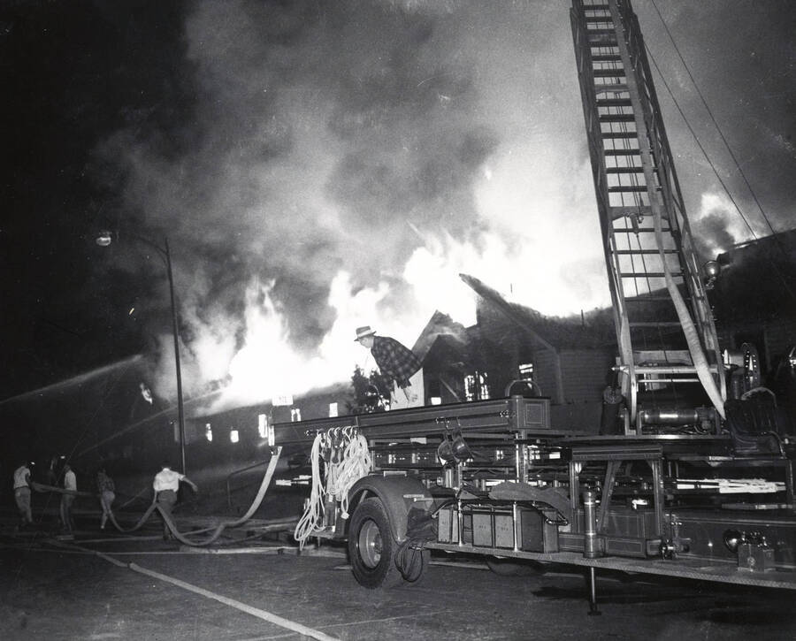 1958 photograph of Campus Club. View of fire truck at the fire. [PG1_072-02]