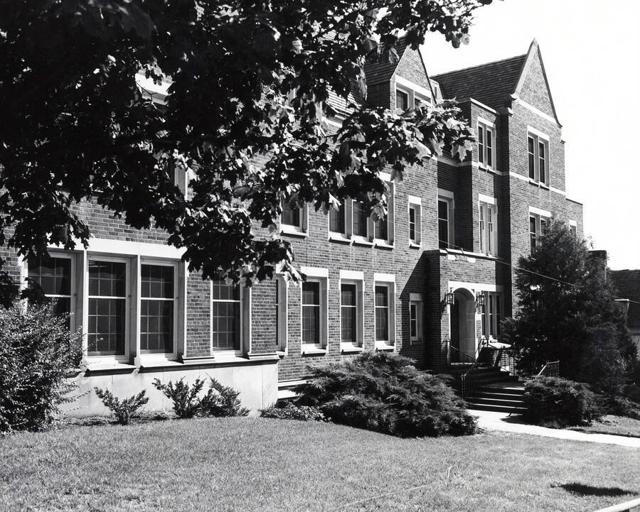 1938 photograph of Infirmary. Front framed by tree. Donor: Publications Dept. [PG1_074-22]