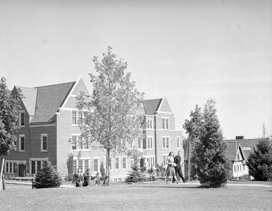 1940 photograph of Infirmary. Students walk to class. [PG1_074-28]