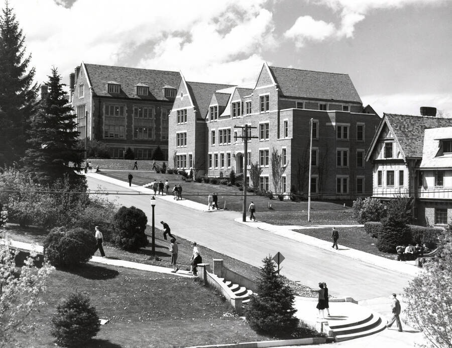 1962 photograph of Infirmary. View of Hello Walk and students. [PG1_074-32]