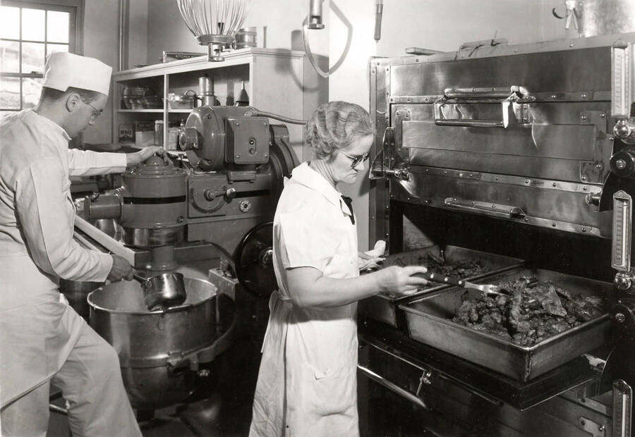 1936 photograph of Willis Sweet Hall. View of the kitchen and staff. [PG1_075-03]