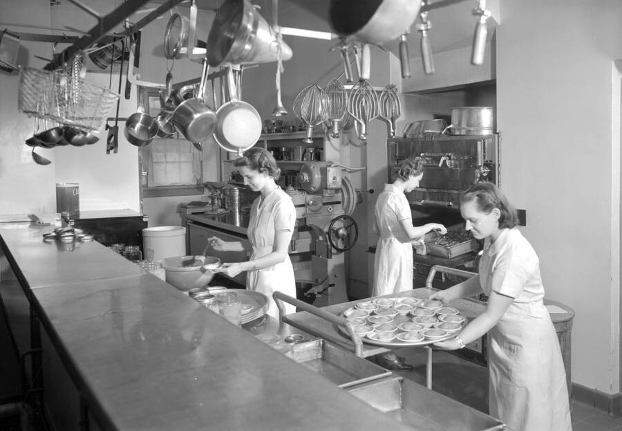 1937 photograph of Willis Sweet Hall. View of the kitchen and staff. [PG1_075-09]