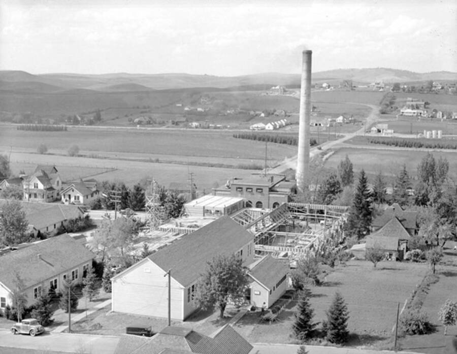 1942 photograph of Kirtley Engineering Laboratory. View of the construction with the power plant stack in the background.[PG1_084-19]
