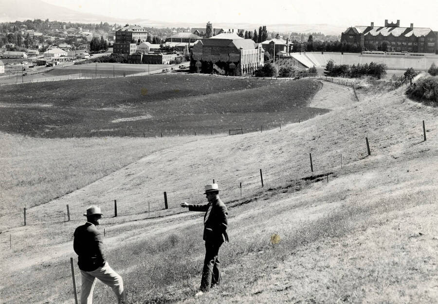 Neale Stadium, University of Idaho. Examining the site. [85-11]