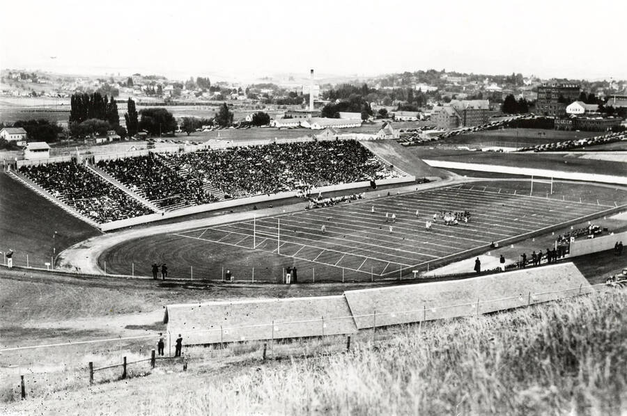 1939 photograph of Neale Stadium. View shows the grandstands full of fans at the football game. Donor: Publications Dept. [PG1_085-12]