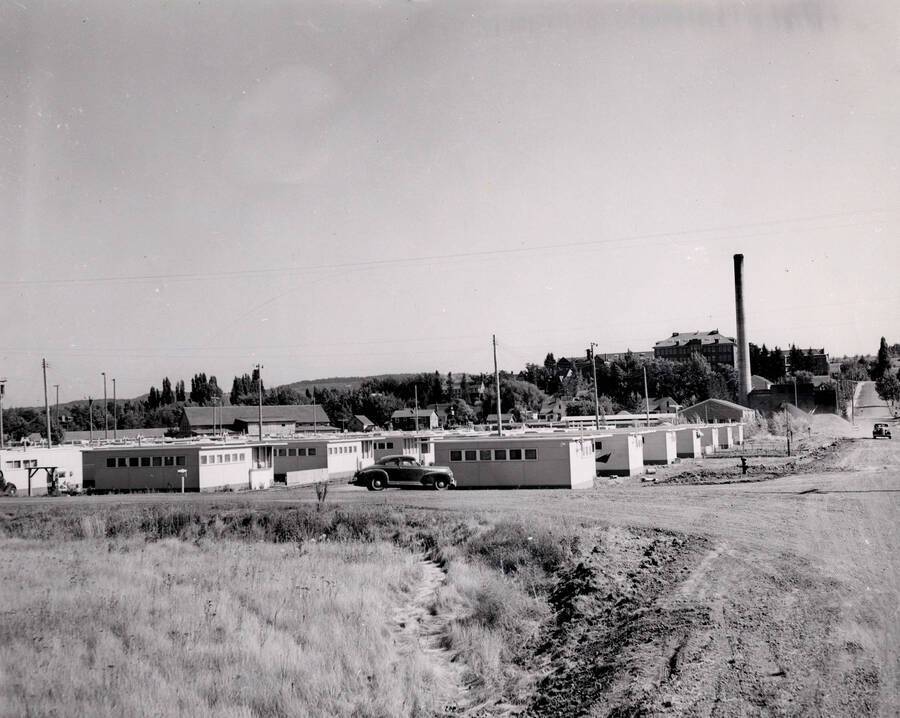 1946 photograph of Park Village. Power plant stack is visible on the right. Donor: Publications Dept. [PG1_090-04]