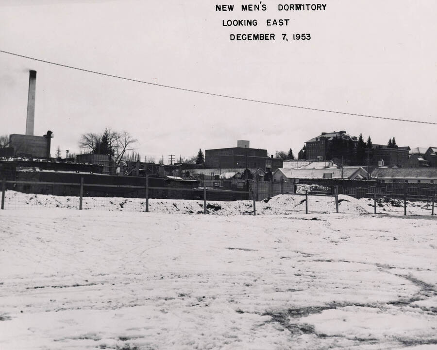 December 7, 1953 photograph of Gault Hall under construction. Snow covers the scene. [PG1_095-11a]