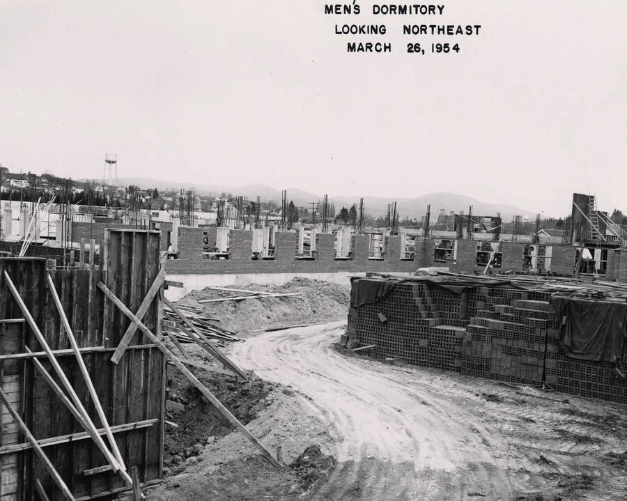 March 26, 1954 photograph of Gault Hall under construction. Water tower in the background. [PG1_095-13b]