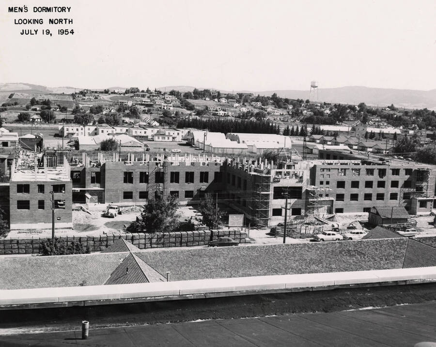 July 19, 1954 photograph of Gault Hall under construction. Water tower in the background. [PG1_095-17a]