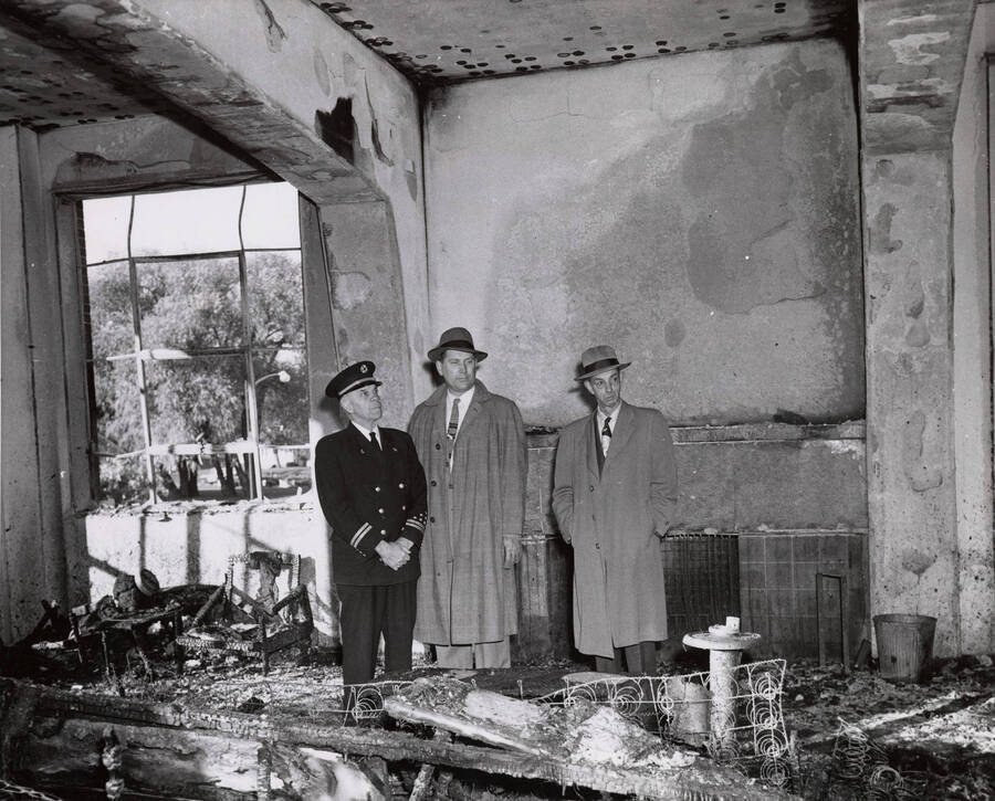 1956 photograph of Gault Hall Left to right: Moscow Fire Chief Carl Smith, underwriter's official Thor Fledstad, and Washington state deputy fire marshall Leonard Burgunder. [PG1_095-02]
