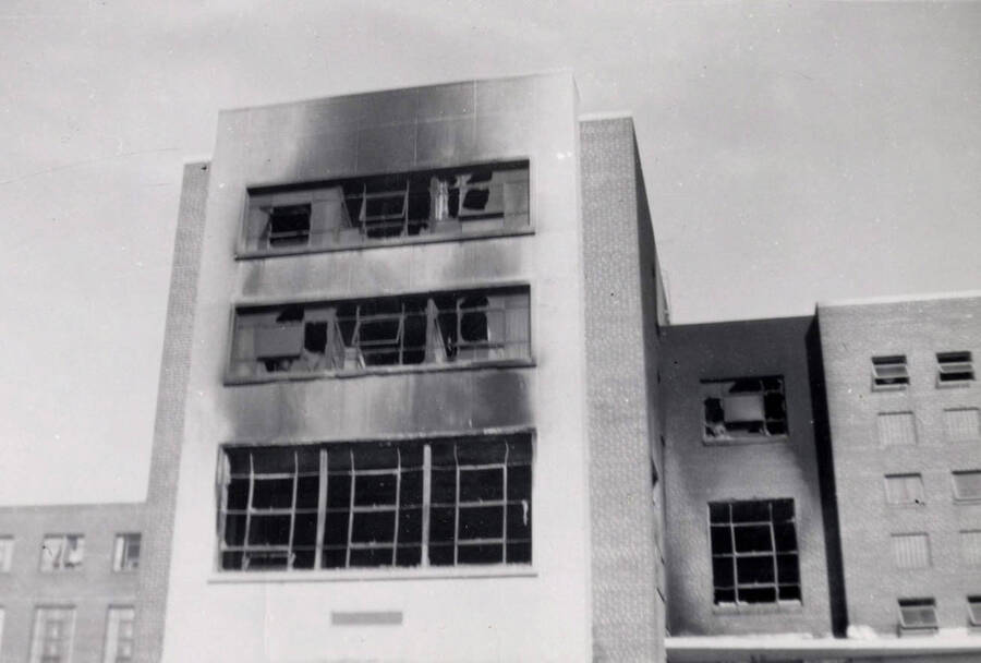1956 photograph of Gault Hall. Fire damage is evident on the exterior of the building. Donor: Maurice Johnson. [PG1_095-22a]