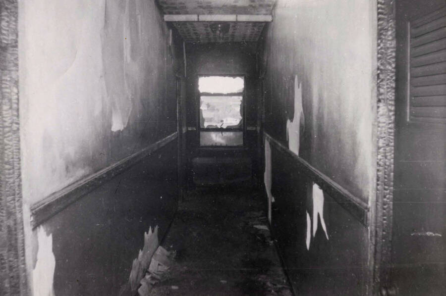 1956 photograph of Gault Hall. Interior photograph of a hallway after a fire. Donor: Maurice Johnson. [PG1_095-22c]