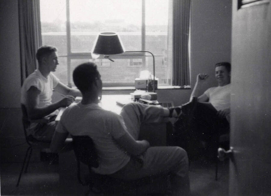 May 1, 1956 photograph of Gault Hall. Left to right: Steve Hickley, Lon Davis, and unidentified. Donor: Maurice Johnson. [PG1_095-23b]