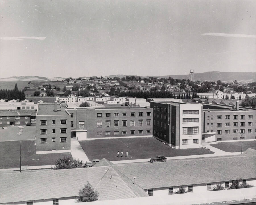 1955 photograph of Gault Hall. Watertower in the background. [PG1_095-05]